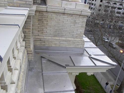 Stainless steel water table and built-in gutter.